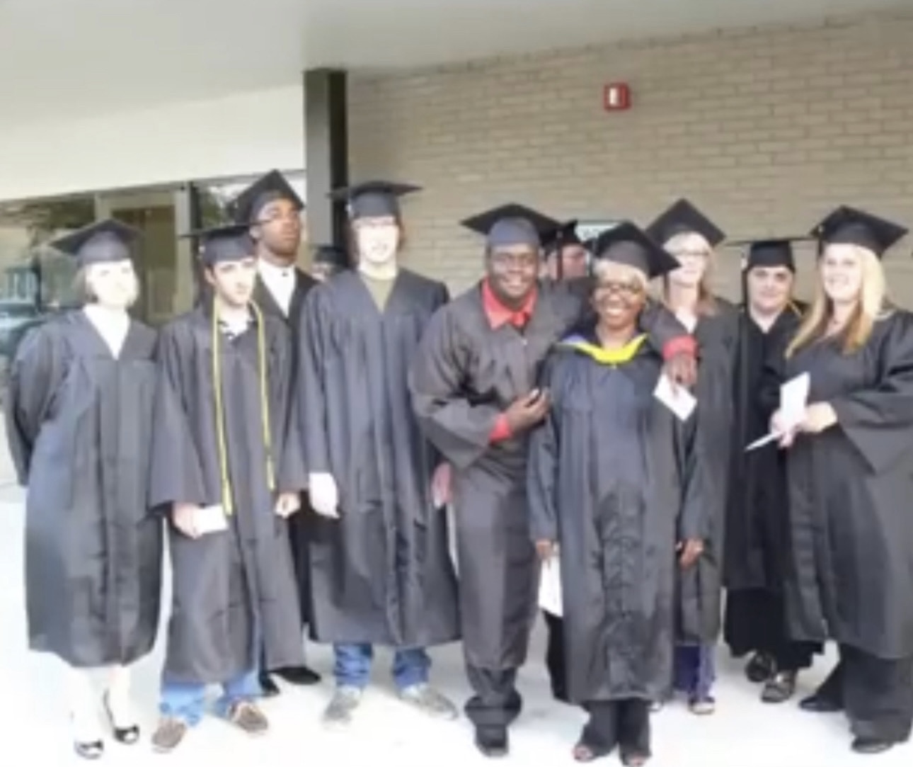 Students celebrating graduation in connection with the Kerry L. Shipman College Readiness Scholarship