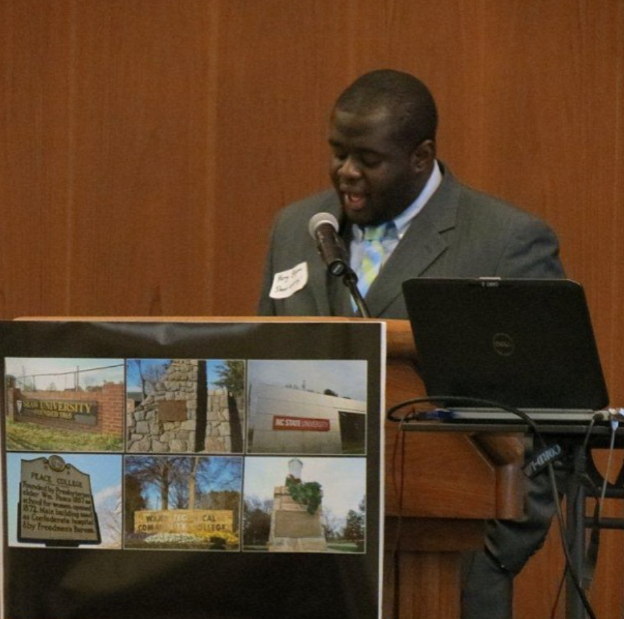 Dr. Kerry Shipman speaking from a lectern at a public event